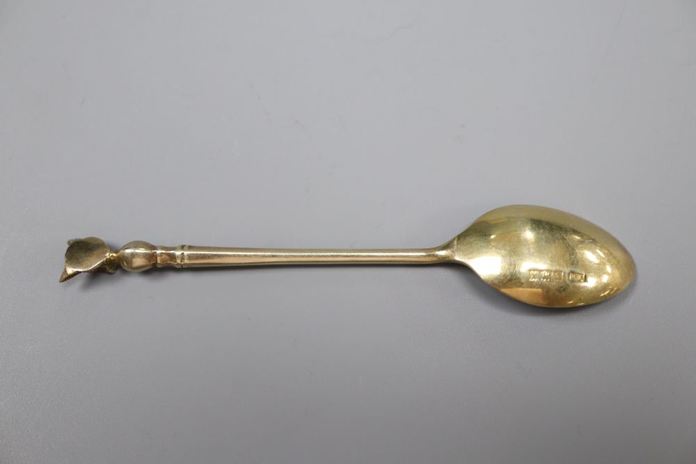 A set of six 1970s silver gilt fox head terminal coffee spoons, 77 grams and a plated set of coffee spoons.